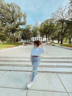 Ashley standing in front of Madison, WI capital building.