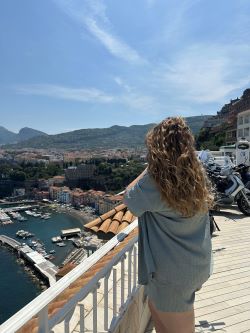 Ashley in front of the city line of Sorrento, Italy.